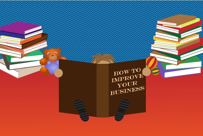 Person reading how to improve your business book