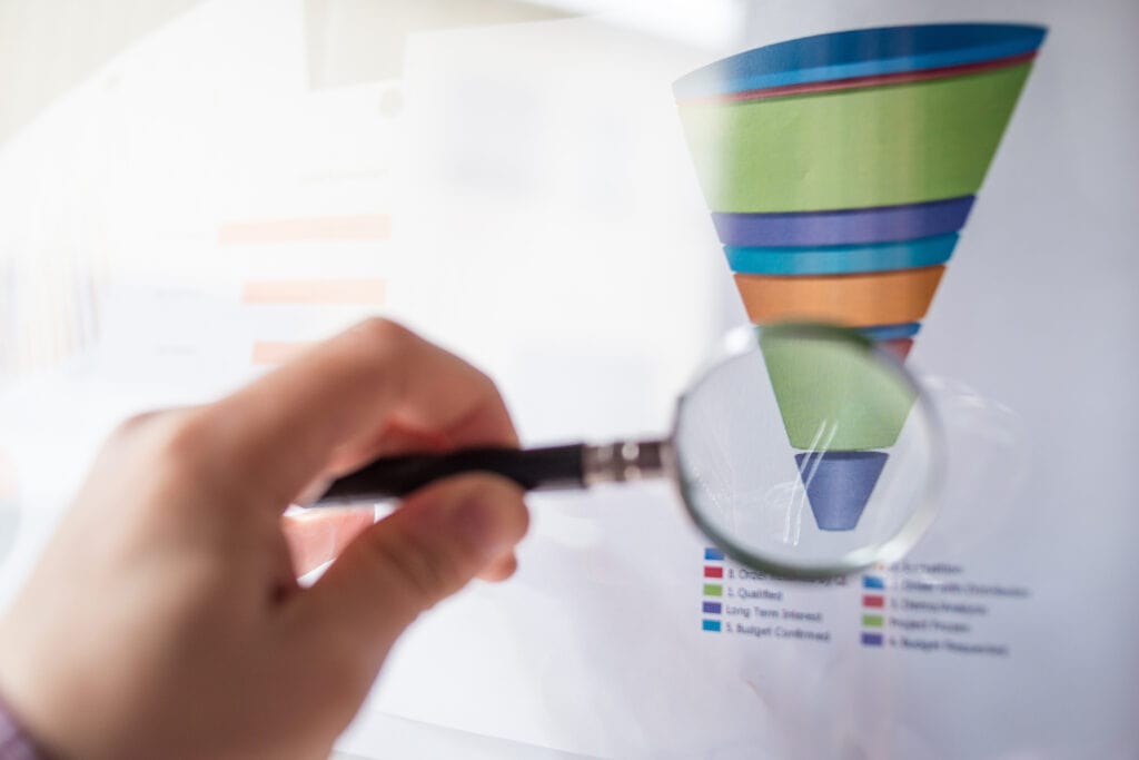 a sales specialist looking at sales pipeline ratio with a magnifying glass